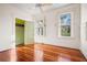 Hardwood floor bedroom with closet and window at 106 Banana St, Tarpon Springs, FL 34689