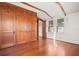 Bedroom with built-in wooden cabinets and hardwood floors at 106 Banana St, Tarpon Springs, FL 34689