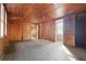 Simple bedroom with wood walls and hardwood floors at 106 Banana St, Tarpon Springs, FL 34689