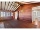 Spacious bedroom with wood walls and hardwood floors at 106 Banana St, Tarpon Springs, FL 34689