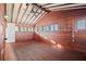 Charming bedroom with wood walls and hardwood floors at 106 Banana St, Tarpon Springs, FL 34689