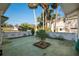 Small courtyard with plants and a brick planter at 106 Banana St, Tarpon Springs, FL 34689
