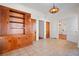 Spacious dining area with built-in wooden cabinetry and hardwood floors at 106 Banana St, Tarpon Springs, FL 34689