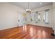 Formal dining room with hardwood floors and large windows at 106 Banana St, Tarpon Springs, FL 34689