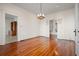 Bright dining room with hardwood floors and access to the sunroom at 106 Banana St, Tarpon Springs, FL 34689