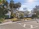 Front view of house and detached garage, street parking visible at 106 Banana St, Tarpon Springs, FL 34689