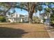 House with detached garage and boat, large grassy backyard at 106 Banana St, Tarpon Springs, FL 34689