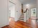 Stairway with wooden bannister and hardwood floors at 106 Banana St, Tarpon Springs, FL 34689