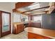 Kitchen boasts wood cabinets and a stainless steel refrigerator at 106 Banana St, Tarpon Springs, FL 34689
