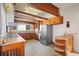 Kitchen with wood cabinets, stainless steel appliances, and tile floors at 106 Banana St, Tarpon Springs, FL 34689