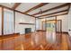Living room with hardwood floors, fireplace and access to the sunroom at 106 Banana St, Tarpon Springs, FL 34689