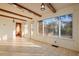 Bright sunroom with tile floors and wood beams at 106 Banana St, Tarpon Springs, FL 34689