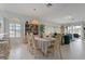 Spacious dining room with neutral colors, recessed lighting and tile floors provides seamless transition to the living room at 1082 Dartford Dr, Tarpon Springs, FL 34688