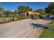 Beautiful entry gate with lush landscaping, fountain, and controlled access at 1082 Dartford Dr, Tarpon Springs, FL 34688