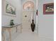 Welcoming foyer with tile flooring, decorative accents, and ample natural light at 1082 Dartford Dr, Tarpon Springs, FL 34688