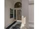 Inviting front entrance featuring a decorative door with sidelight window at 1082 Dartford Dr, Tarpon Springs, FL 34688