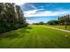 Well-maintained golf course with lush green grass and beautiful surrounding scenery at 1082 Dartford Dr, Tarpon Springs, FL 34688