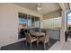 Outdoor patio with a ceiling fan, dining table, and outdoor kitchenette at 1082 Dartford Dr, Tarpon Springs, FL 34688