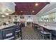 Inviting restaurant interior with bar, seating, and large windows at 1082 Dartford Dr, Tarpon Springs, FL 34688