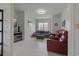 Inviting sitting room with neutral paint, tile flooring and plenty of natural light creates a cozy and relaxing atmosphere at 1082 Dartford Dr, Tarpon Springs, FL 34688