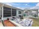 Backyard has a screened-in porch area and a fire pit at 11731 Linden Dr, Spring Hill, FL 34608