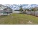 An expansive backyard with a hammock, shed and screened-in porch at 11731 Linden Dr, Spring Hill, FL 34608