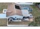Aerial view of a backyard with a screened pool, patio, and a storage shed at 11731 Linden Dr, Spring Hill, FL 34608