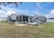 Large backyard features a porch and a screened-in porch at 11731 Linden Dr, Spring Hill, FL 34608