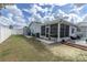 The backyard features a porch and a screened-in porch at 11731 Linden Dr, Spring Hill, FL 34608