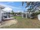 Large backyard with a porch and a storage shed at 11731 Linden Dr, Spring Hill, FL 34608