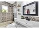 Updated bathroom with tub, shower, unique tiles, and modern fixtures at 11731 Linden Dr, Spring Hill, FL 34608