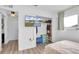 Bedroom featuring wood floors, walk-in closet and television on the wall at 11731 Linden Dr, Spring Hill, FL 34608