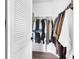 Corner walk in closet featuring wood floors and plenty of storage at 11731 Linden Dr, Spring Hill, FL 34608