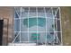 Overhead shot of a screened-in pool with outdoor seating and lush surroundings at 11731 Linden Dr, Spring Hill, FL 34608
