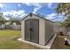 An outdoor storage shed sits in a fenced backyard at 11731 Linden Dr, Spring Hill, FL 34608
