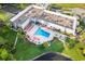 Community pool and clubhouse viewed from above at 11830 Wax Myrtle Ct, New Port Richey, FL 34654