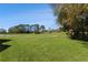 Landscaped backyard with golf course views at 11830 Wax Myrtle Ct, New Port Richey, FL 34654