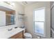 Clean bathroom with single sink vanity and shower/tub combo at 11830 Wax Myrtle Ct, New Port Richey, FL 34654