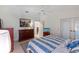 Spacious bedroom with king-size bed and double door access at 11830 Wax Myrtle Ct, New Port Richey, FL 34654