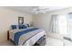 Main bedroom with king-size bed and window at 11830 Wax Myrtle Ct, New Port Richey, FL 34654