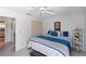 Bright bedroom with a king-size bed and built-in closet at 11830 Wax Myrtle Ct, New Port Richey, FL 34654