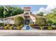 Community clubhouse with pool access and landscaping at 11830 Wax Myrtle Ct, New Port Richey, FL 34654