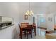 Cozy dining area with a table and chairs, near the kitchen at 11830 Wax Myrtle Ct, New Port Richey, FL 34654