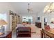 Spacious living room with built-in shelving and comfortable seating at 11830 Wax Myrtle Ct, New Port Richey, FL 34654