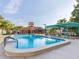 Inviting community pool with lounge chairs and a covered area at 11830 Wax Myrtle Ct, New Port Richey, FL 34654