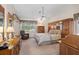 Large main bedroom with a king-size bed and ample wood furniture at 13429 Lawrence St, Spring Hill, FL 34609