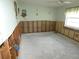 A bedroom showing water damage and exposed framing, requiring complete renovation at 13737 Michelle Ave, Hudson, FL 34667