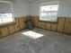 Needs renovation, showing exposed walls and flooring at 13737 Michelle Ave, Hudson, FL 34667