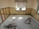 Room undergoing renovation with exposed walls and debris at 13737 Michelle Ave, Hudson, FL 34667