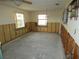 A dining room in need of complete renovation, showing significant water damage at 13737 Michelle Ave, Hudson, FL 34667